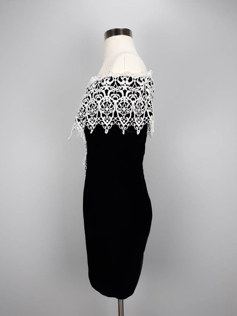 Vintage black velvet off the shoulder mini dress with white embroidered lace trim