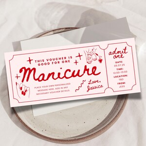 May include: A pink and red printable gift certificate for a manicure. The text reads "This voucher is good for one manicure." and "admit one". The voucher includes space to add a personalized message, date, time, location, and from.