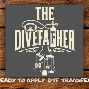 May include: A dark gray square graphic featuring the off-white text THE DIVEFATHER. The design includes a diving mask, a scuba tank, and a hand holding strings attached to a diving reel, a bell, and a fish. The text READY TO APPLY DTF TRANSFER appears below.