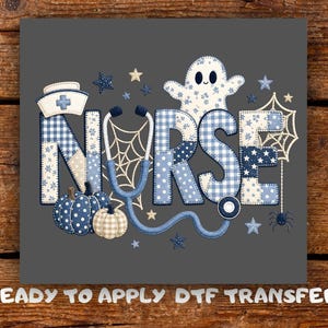 May include: A ready to apply DTF transfer featuring the word NURSE in blue and white plaid and polka dot patterns. The design includes a nurse cap, a stethoscope, a ghost, pumpkins, spider webs, a spider, and stars on a dark grey background.