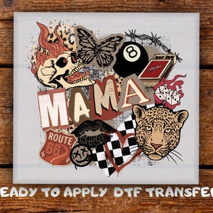 May include: A graphic design with a skull, butterfly, 8-ball, matchbox, dice, leopard, lips, Route 66 sign, and the word "MAMA". The design includes a heart with a checkered pattern and the text "READY TO APPLY DTF TRANSFER".