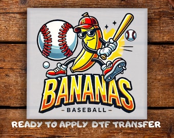 May include: A cartoon graphic featuring a yellow banana wearing sunglasses and a baseball cap, holding a bat and playing baseball. The design includes a baseball, the words "BANANAS BASEBALL", and a baseball. Ready to apply DTF transfer.
