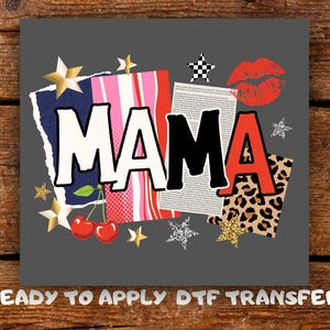 May include: A grey graphic design featuring the word "MAMA" in bold letters. The design incorporates a red lip print, cherries, stars, and leopard print accents. The text "READY TO APPLY DTF TRANSFER" is at the bottom.