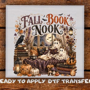 May include: A square DTF transfer featuring the text FALL BOOK NOOK with two ghosts reading books on a purple blanket. The scene includes pumpkins, a black raven, a lantern, stacks of books, and a full moon visible through a window frame.