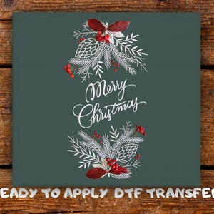 May include: A dark teal graphic with the words "Merry Christmas" in elegant white script. The design includes white pine needles, red berries, and pinecones. The words "READY TO APPLY DTF TRANSFER" are at the bottom.
