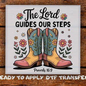 May include: A square graphic featuring a pair of cowboy boots with floral designs, set against a white background. The text "The Lord Guides Our Steps" and "Proverbs 16:9" are displayed. The words "READY TO APPLY DTF TRANSFER" are also visible.