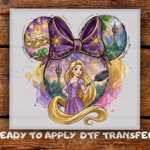 May include: A DTF transfer featuring a watercolor illustration of Rapunzel with long blonde hair, holding a frying pan. The design is set within a Mickey Mouse ear shape, with a purple bow and elements from the movie, including lanterns and a tower.