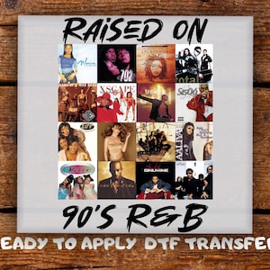 May include: A white square featuring album covers of 90s R&B artists. The words "RAISED ON" and "90'S R&B" are in black, stylized text. The phrase "READY TO APPLY DTF TRANSFER" is also present. The image is on a wooden surface.