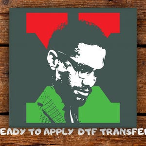 May include: A square graphic featuring a stylized portrait of a man in glasses, rendered in white and black against a dark green background. Red and green geometric shapes frame the portrait. The text "READY TO APPLY DTF TRANSFER" is at the bottom.