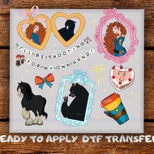 May include: A DTF transfer sheet featuring cartoon illustrations of a red-haired character, black bears, a horse, a heart-shaped cake, and a coffee cup. Text reads I'LL BE SHOOTING FOR MY OWN HAND and READY TO APPLY DTF TRANSFER with decorative frames.