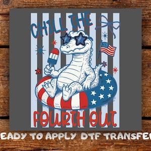 May include: A graphic design featuring a cartoon alligator wearing star-shaped sunglasses and holding a popsicle. The alligator is floating on a red, white, and blue inner tube. The text "CHILL THE FOURTH OUT" is displayed.
