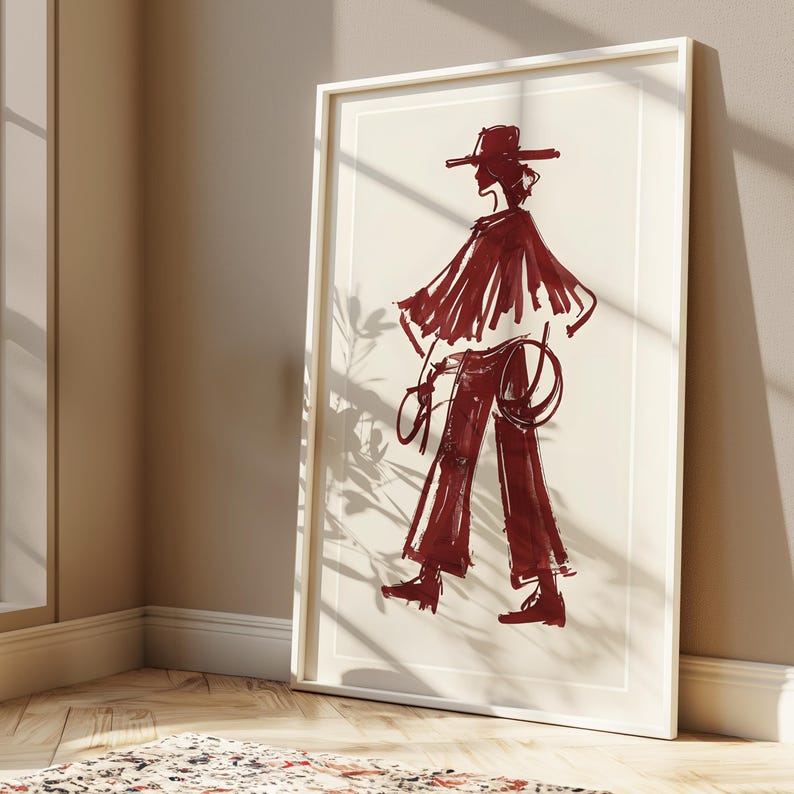 May include: A framed illustration of a person wearing a wide-brimmed hat and a long, flowing garment. The illustration is done in shades of red and white.