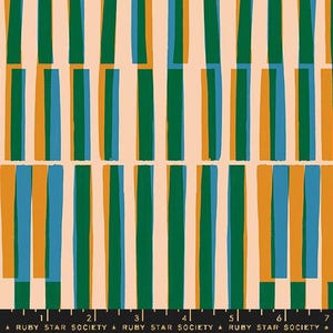 May include: A fabric print featuring a repeating pattern of vertical bars in dark green, blue, and orange on a light peach background. A black ruler with white markings and the text "RUBY STAR SOCIETY" is visible along the bottom edge.