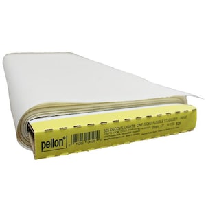 May include: A roll of beige Pellon Decovil Light one-sided fusible stabilizer. The product is in a yellow and brown box with the product name and specifications printed on it. The roll is 17 inches wide and 10 yards long.