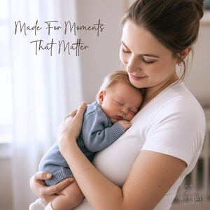 May include: A baby wearing a blue knitted romper is held against a person wearing a white t-shirt. The text "Made For Moments That Matter" is visible in the upper left corner, and the logo "serenity stitch co" is in the bottom right corner.