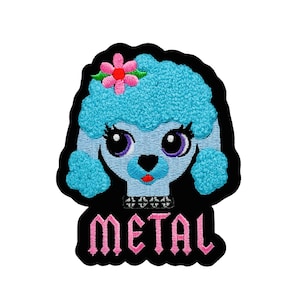 May include: Embroidered patch featuring a cartoon poodle with a blue afro, pink flower, and large eyes. The patch has the word "METAL" in pink gothic lettering on a black background.