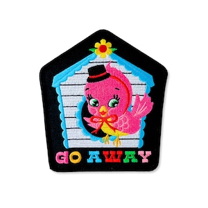 May include: Embroidered patch featuring a pink bird wearing a black top hat and a red bow tie, inside a blue and white birdhouse. The patch is black with the words "GO AWAY" in colorful letters.