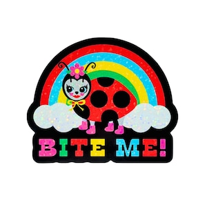 May include: A colorful sticker featuring a ladybug with a rainbow and clouds. The ladybug has a flower on its head and is wearing pink boots. The text "BITE ME!" is displayed in vibrant colors below the ladybug and rainbow.