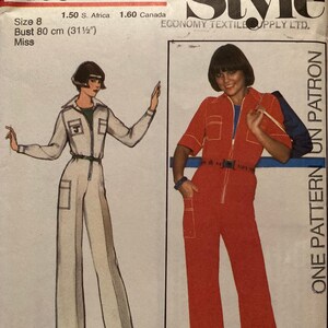 May include: A vintage sewing pattern for a jumpsuit with a zip fastening. The pattern is for size 8 and has a bust measurement of 80 cm. The pattern is from Economy Textile Supply Ltd. and is called "Style".