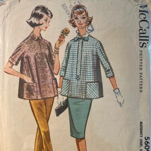 May include: Vintage McCall's printed pattern 5609 showing maternity shirt, skirt, and pants designs. The pattern includes a pink floral shirt, yellow trousers, and a blue and white checkered jacket and skirt. The bust size is 81 cm.