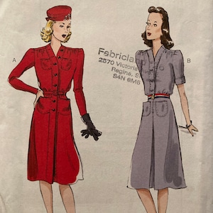 May include: Butterick sewing pattern B6282 with two vintage dress designs. One dress is red with long sleeves, a belt, and pockets. The other is grey with short sleeves, a belt, and pockets. Sizes 16-24 are included in the pattern.