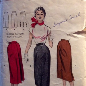 May include: A vintage sewing pattern for a skirt with three different styles. The pattern is for a size 24 waist and is labelled "Butterick Printed Pattern". The pattern includes instructions for making a skirt with a red, black, and brown fabric.