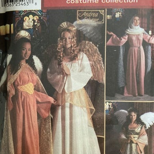 May include: A sewing pattern for three holiday costumes: an angel, a medieval maiden, and a second angel. The pattern is from Simplicity and is part of their Holiday costume collection. The pattern is designed by Andrea Schewe.