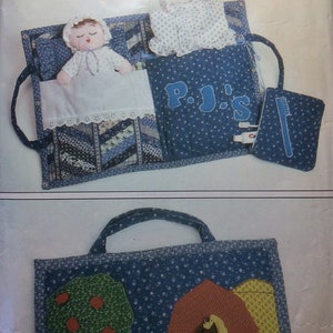 May include: A craft pattern for making a blue and white fabric doll bed with a doll and a blue and white fabric tote bag with a red barn and a green tree.