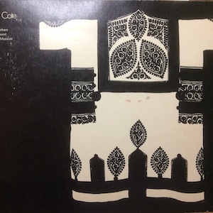 May include: A black and white illustration of a garment design, with the text "Cut My Cote" at the top. The design features intricate patterns and is from the Royal Ontario Museum.