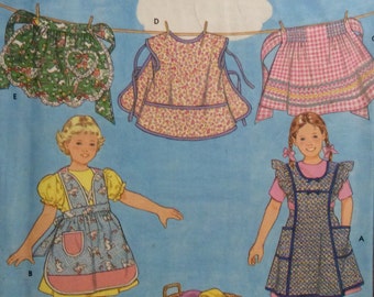Retro Style Sewing Pattern Childs Aprons 5 Styles Size 3-8