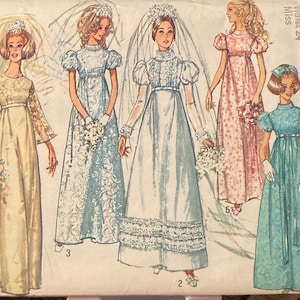 May include: Vintage Simplicity sewing pattern #3589 for a bridal gown. The pattern includes four different styles of wedding dresses, with lace, ruffles, and long sleeves. The pattern is for sizes 10-18, bust 32-38, waist 24-30.