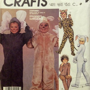 May include: A sewing pattern for making animal costumes. The pattern includes instructions for making a tiger, a bunny, a mouse, and a cat costume. The pattern is for sizes 8. The pattern is from McCall's Crafts.