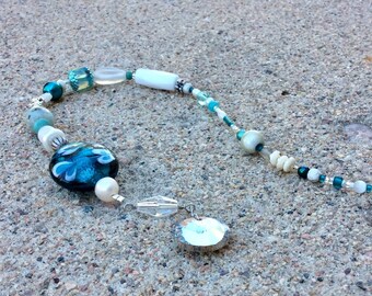 Sun catcher decoration.  Window charm. Teal aqua white. Heart lampwork bead. handmade beaded gift.