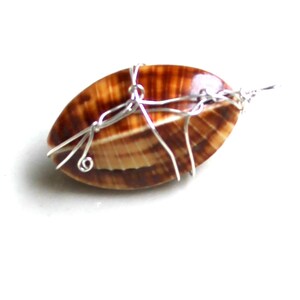 tribal shell pendant.  Sterling wrapped iridescent blue & brown seashell pendant. gothic. steampunk