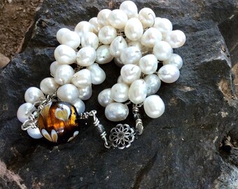 Inner workings of the heart. Lampwork heart focal. Wire wrapped bracelet.    White pearls.  Flower box clasp