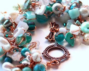 copper wrapped moonstone story bracelet. turquoise and white beads. wire wrapped uniquenecks jewelry. layered gemstones