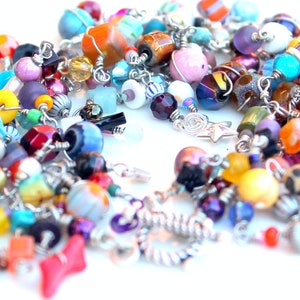 friendship bracelet. layered rainbow. bracelet. multicolored beads. sterling silver clasp. tactile heaven.