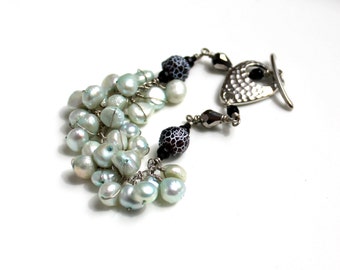 mint lava bracelet / light teal wire wrapped pearls / faceted grey glass