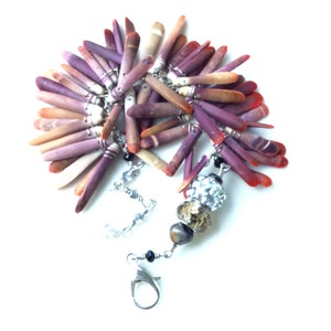 sea urchin bracelet. tribal beauty. wire wrapped coral sticks cross and swarovski. sterling silver clasp. handmade by uniquenecks