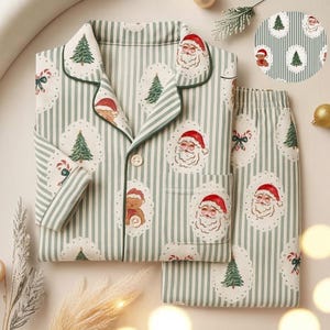 May include: A two-piece pajama set featuring a green and white striped pattern. The set includes a button-down shirt and pants, both adorned with Santa Claus, Christmas tree, and teddy bear illustrations. The shirt has a green trim.