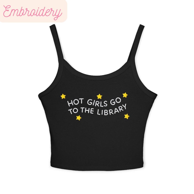 May include: Black camisole top with the text "HOT GIRLS GO TO THE LIBRARY" in white, accompanied by yellow star graphics. The top has thin straps and a scoop neckline. The word "Embroidery" is in the top left corner.