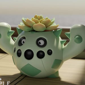 May include: A light green cactus-shaped planter with a succulent plant. The planter has black eyes and a series of black dots. The succulent has yellow and green leaves. The planter is on a bamboo mat.