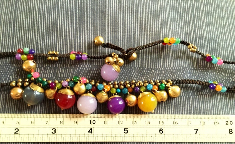 Cute group round gems beads /& brass bell necklace