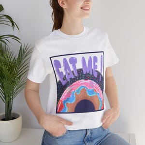 Whimsical Donut Graphic Tee, Fun Foodie T-Shirt, Summer Casual Wear, Gift for Food Lovers, Playful Eat Me Shirt