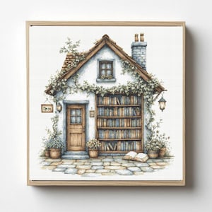 May include: Cross-stitch art of a quaint cottage with a wooden door, window, and a chimney. The cottage is adorned with climbing vines and a large bookshelf. Potted plants and a stone path complete the scene, framed in a wooden border.