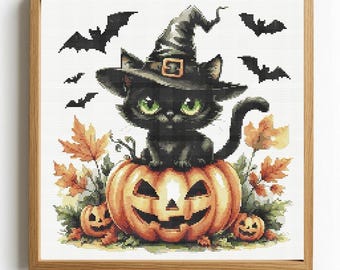 May include: A square framed cross-stitch pattern featuring a black cat with bright green eyes wearing a pointed witch hat, sitting atop a large orange jack-o'-lantern surrounded by smaller pumpkins, autumn leaves, and black bat silhouettes.