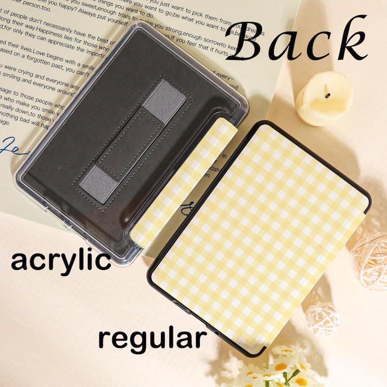 May include: A clear acrylic tablet case with a yellow and white gingham pattern. The case has a black border and a built-in stand. The word "Back" is written in black script. The word "acrylic" and "regular" are also visible.