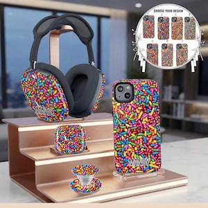 May include: Over-ear headphones, a phone case, an earbud case, and a phone grip, all featuring a colorful sprinkle pattern. The headphones and phone case display the name MANDY in black text. A circular chart shows seven numbered design options.