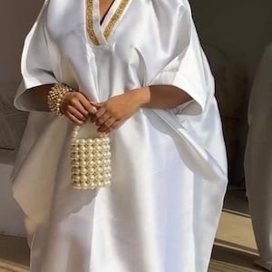 cream drape dress ankara 11 Best Ankara gown with drape ideas