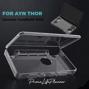 May include: Clear plastic console handheld shell for AYN THOR. The case is open, revealing the interior. The text "FOR AYN THOR Console handheld shell" is at the top. A black handheld console is in the background.